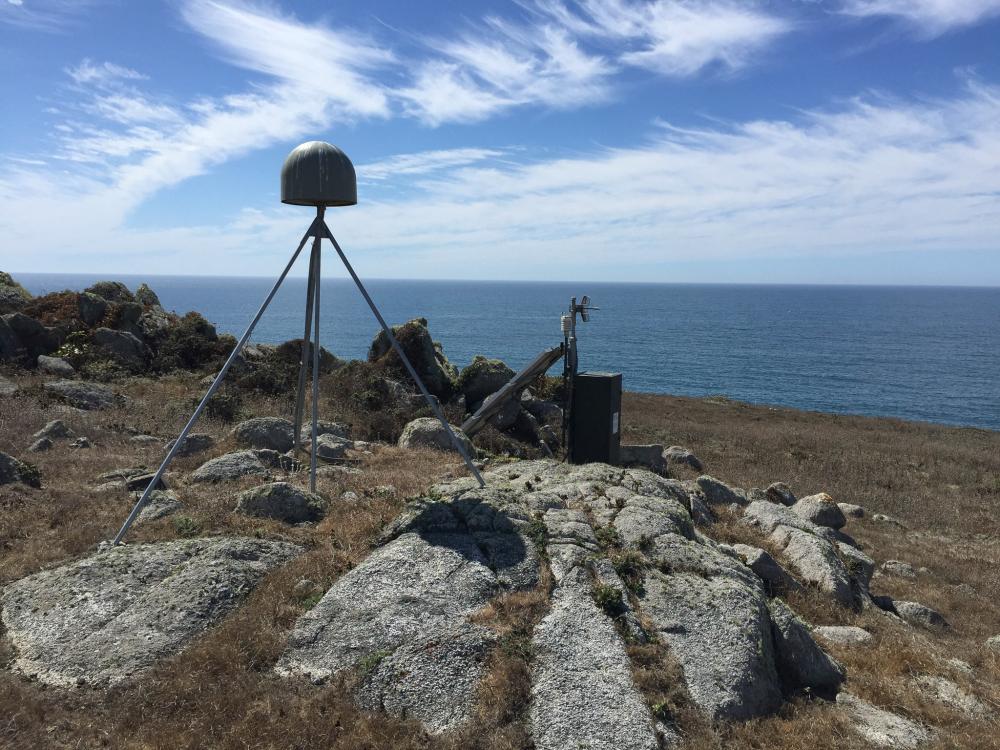 Ocean observing equipment perched on coastal bluffs overlooking the ocean.