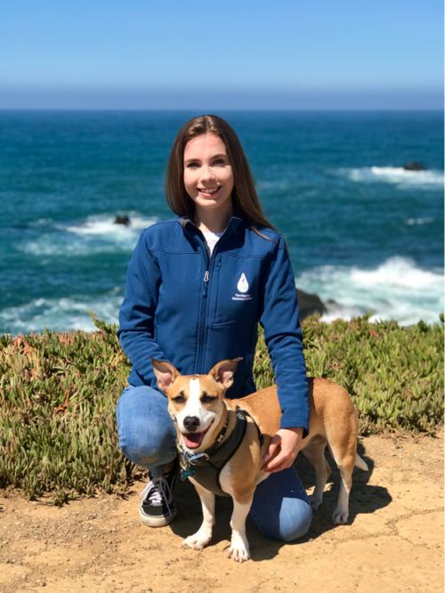 Allie Van with her precious dog by the ocean.