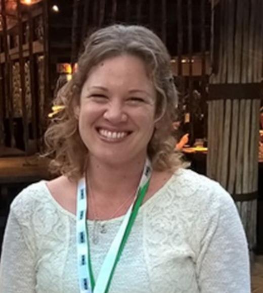 A portrait of Linda Kelly smiling at the camera