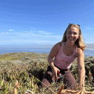 A person working in a coastal prairie